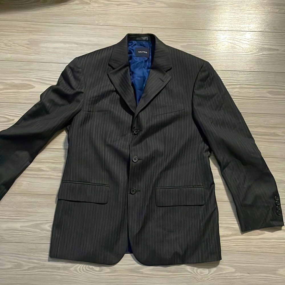 This black Nautica blazer is gray with thin white lines and a blue interior.